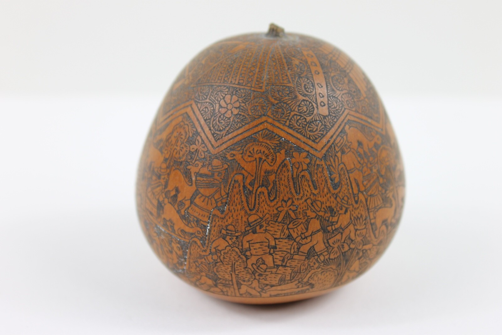One exquisitely carved Peruvian storytelling gourd village life folk art