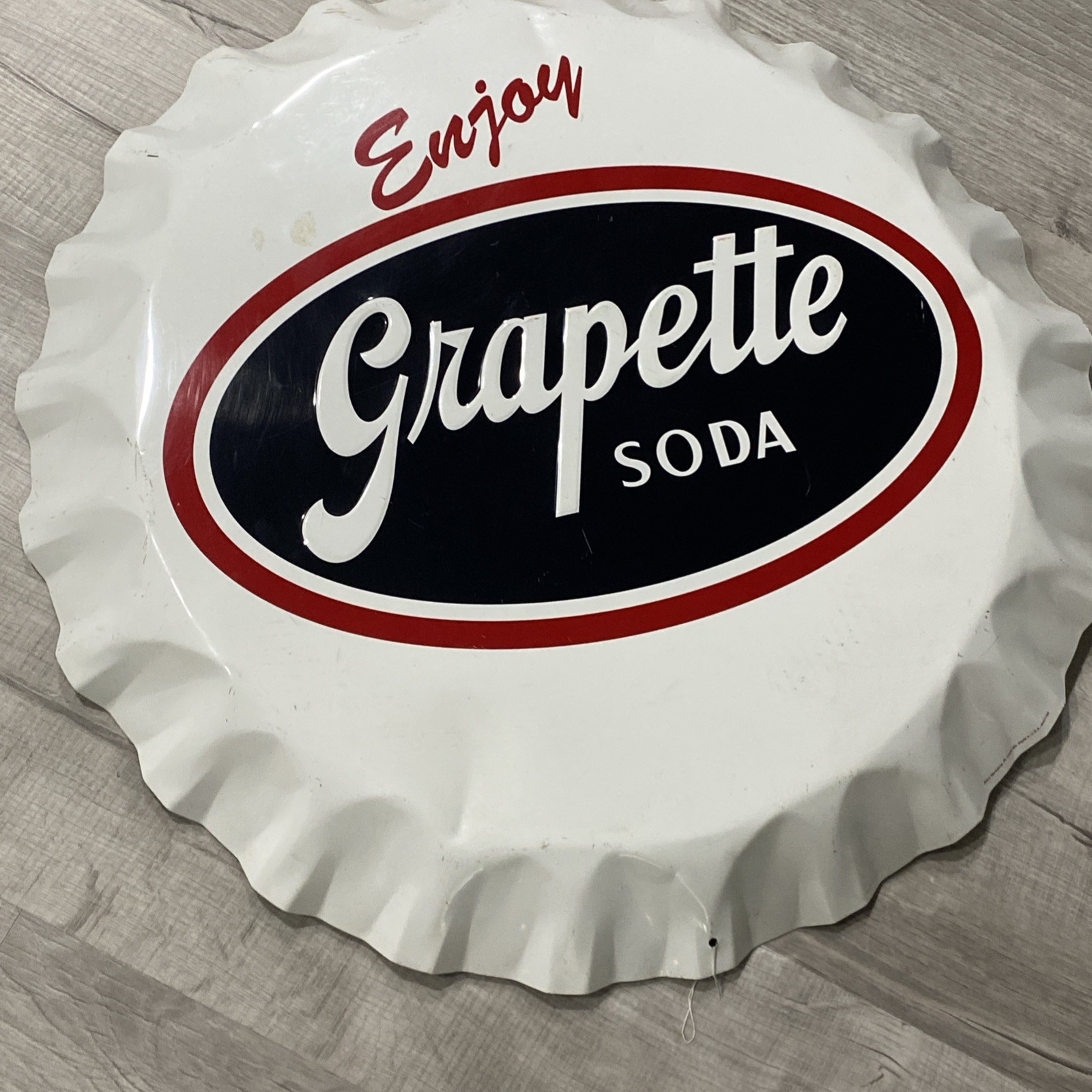 Grapette Bottle Cap Sign Metal Embossed 26.5” Stout Sign Co