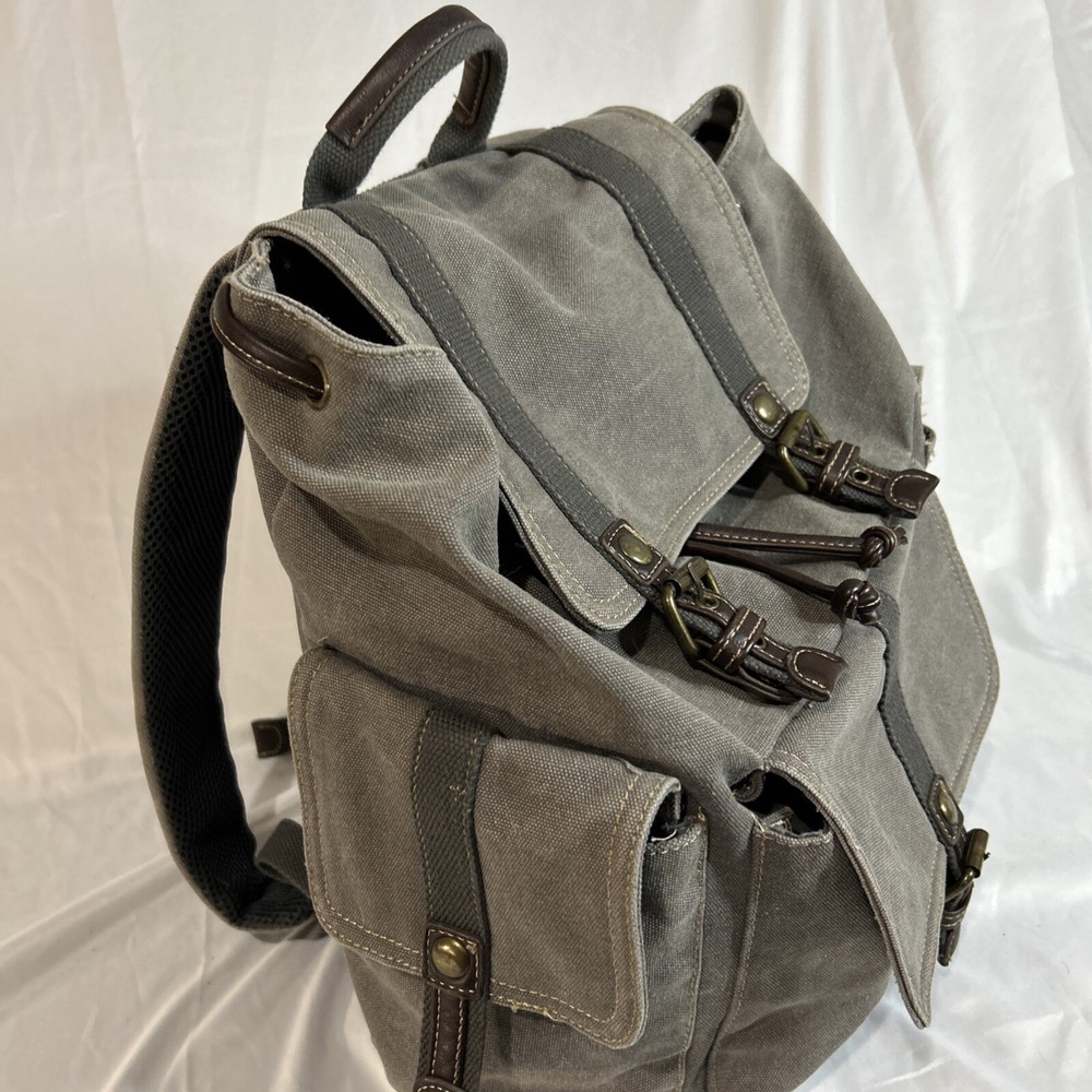 Cargoit Gray Canvas Backpack Magnetic Closures Pockets Straps and A Deep Inside