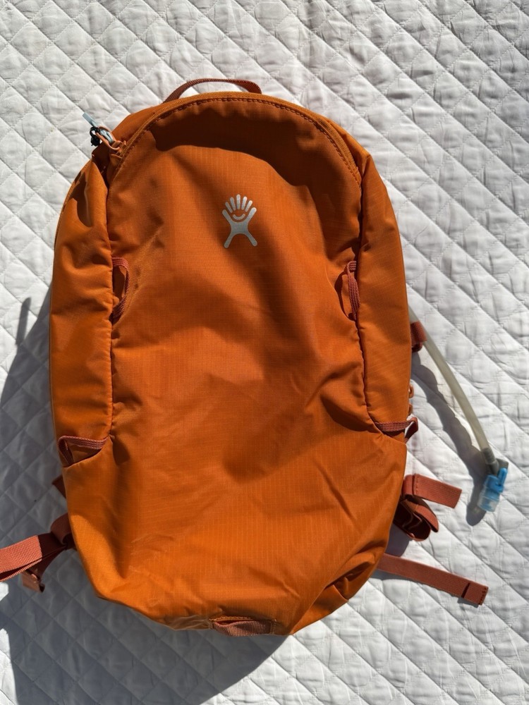 Hydro Flask Down Shift Hiking Backpack 14 Liter Hydration Day Pack Bronze Orange