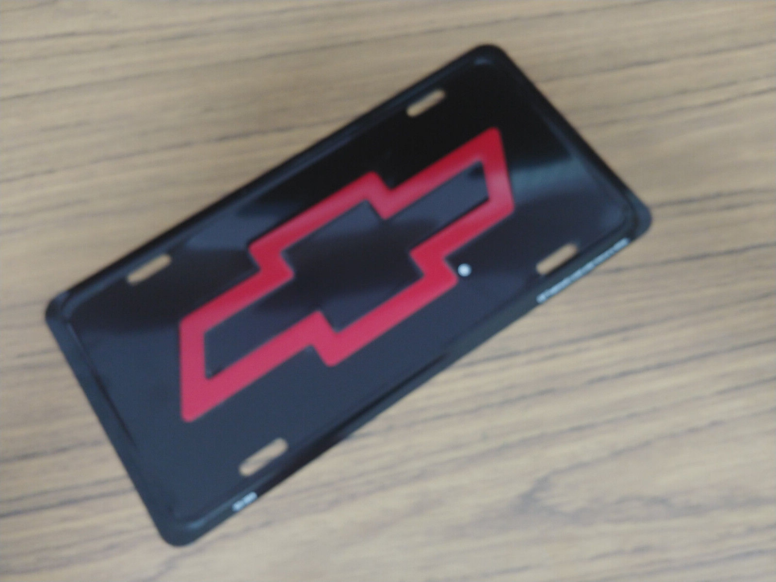 Vintage Chevy License Plate Red Bowtie Bow-Tie Embossed Auto Tag Metal Old Stock