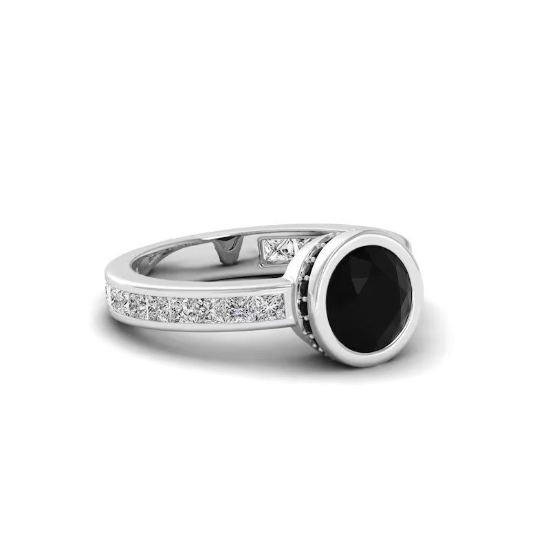 Make a statement with this stunning rose gold ring featuring a round black gemst
