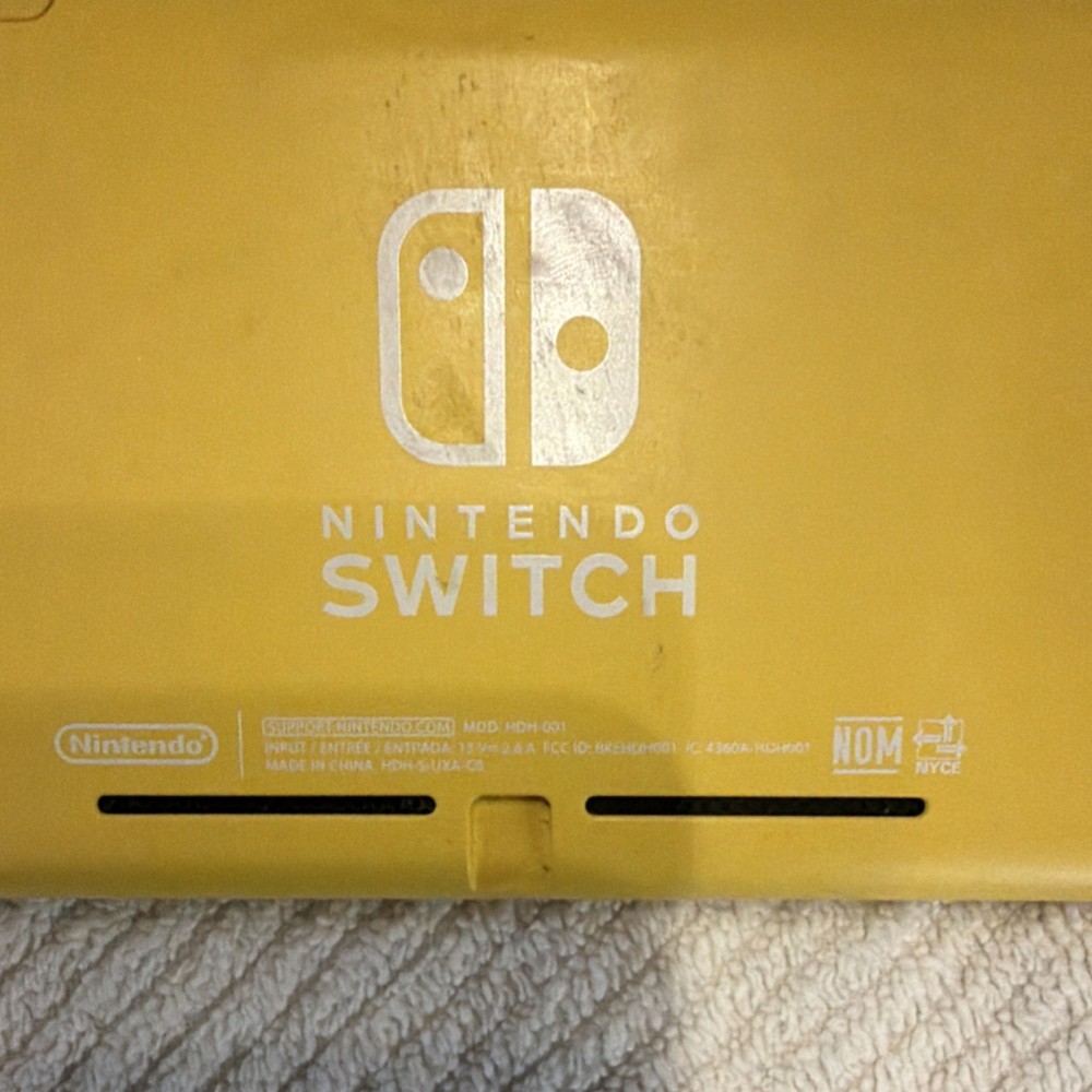 Nintendo Switch Lite Yellow Console Bundle w/ Super Smash Bros Ultimate & Mario…