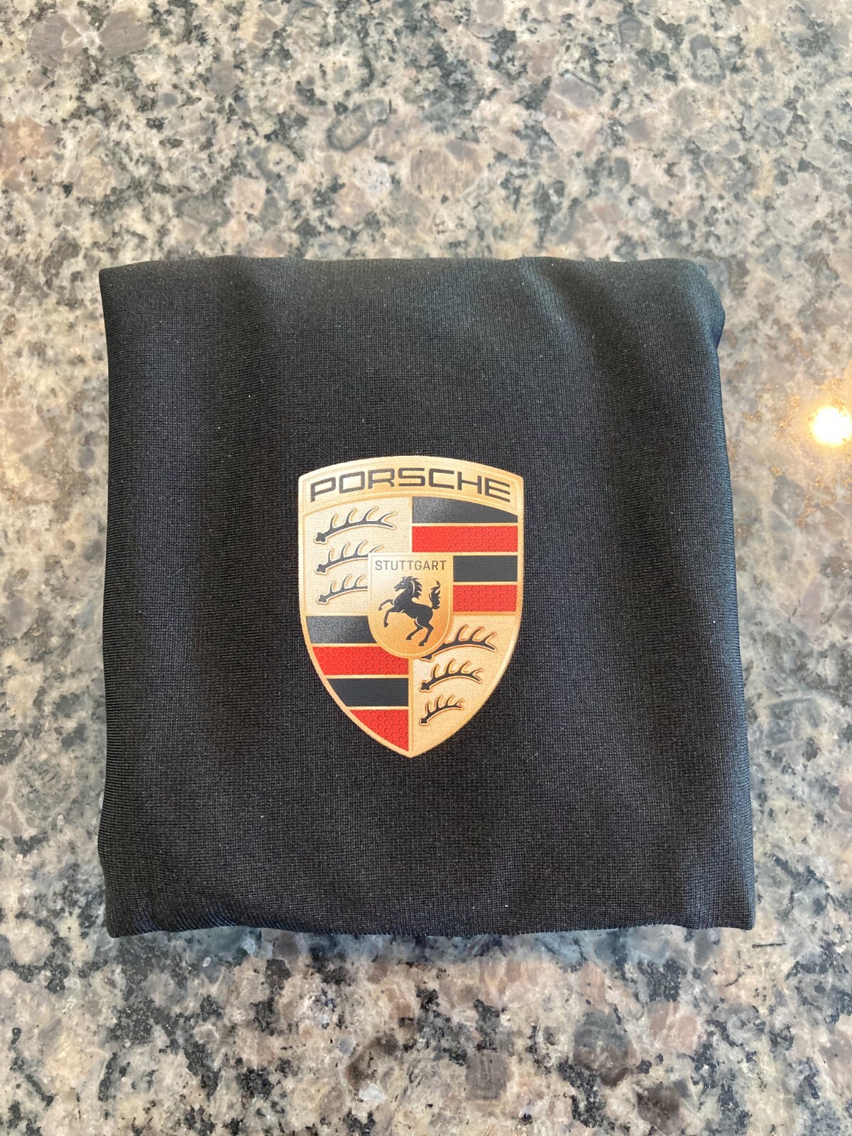 PORSCHE DESIGN OEM FACTORY STEERING WHEEL PROTECTIVE COVER IN BLACK W/CREST. NEW