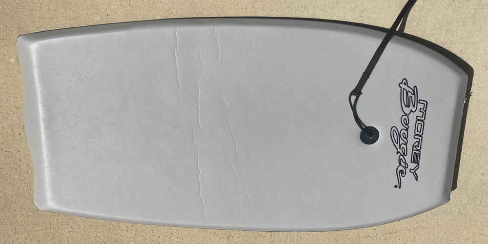 Pre-owned Grey Morey Boogie Board with hard bottom and LEASH