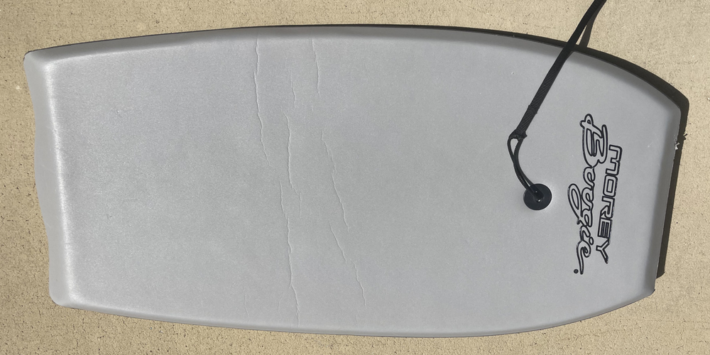 Pre-owned Grey Morey Boogie Board with hard bottom and LEASH