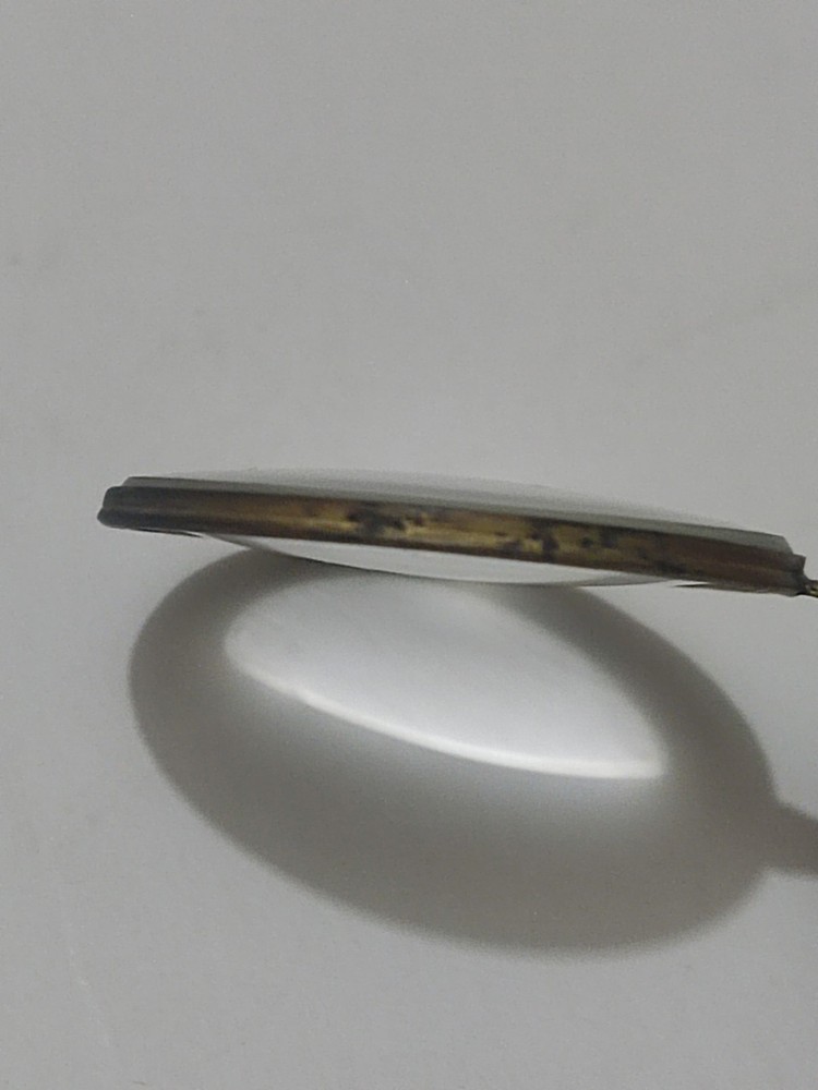 Antique magnifying glass.