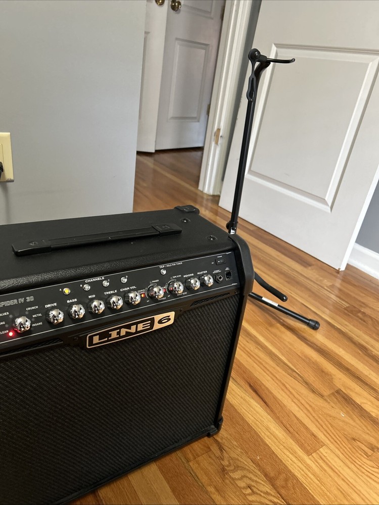 guitar, amp, and stand combo