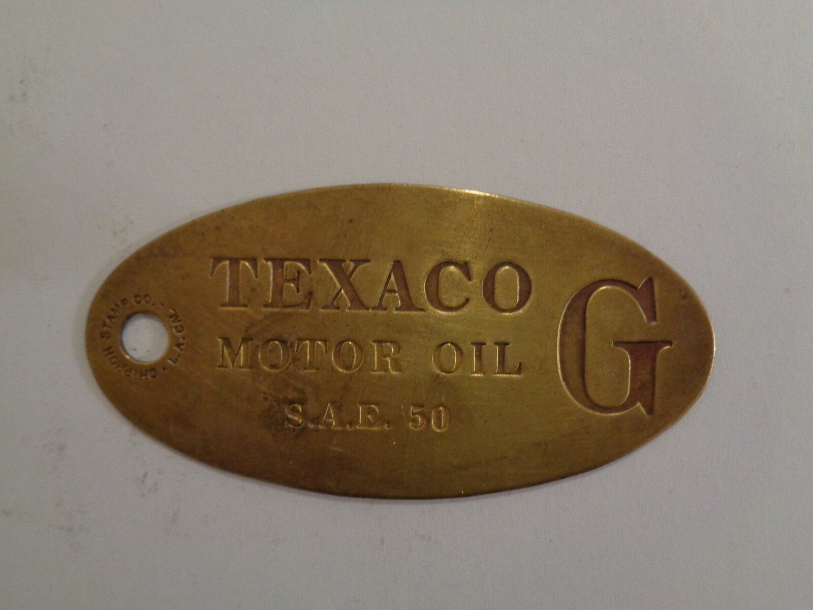 TEXACO OIL COMPANY OVAL BRASS METAL BULK PLANT TAG MOTOR OIL G S.A.E. 50