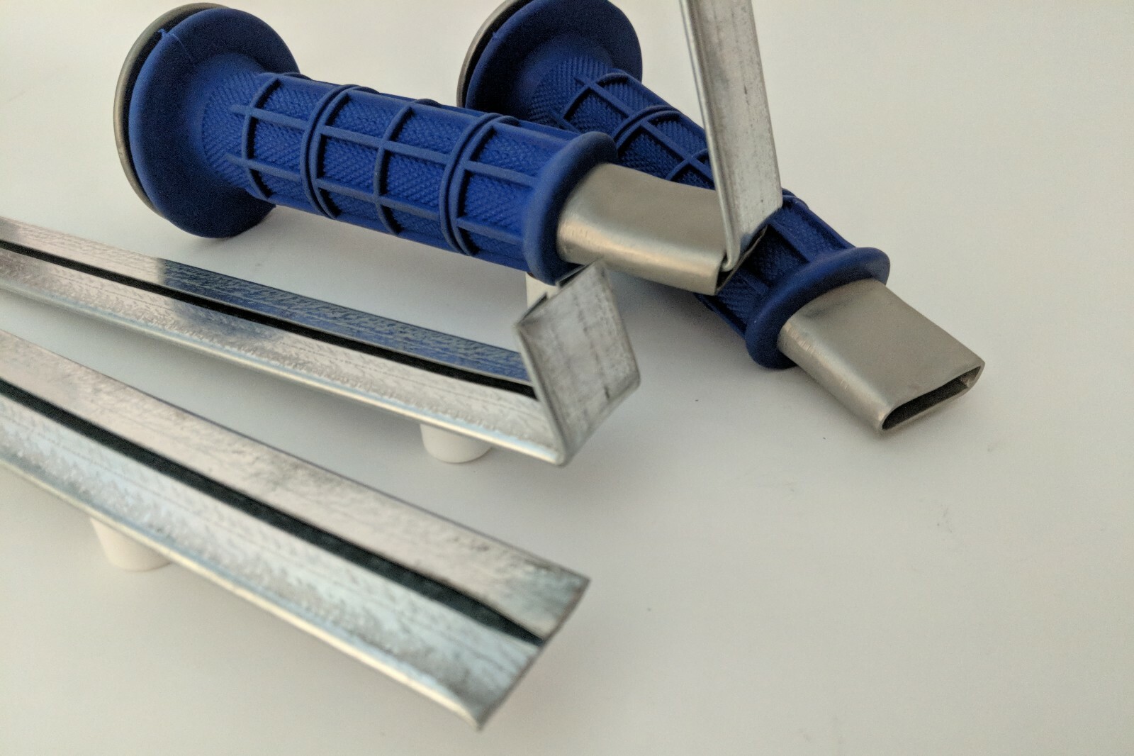 Drive cleat tool in Blue, Red, Gray, Green and Whit.