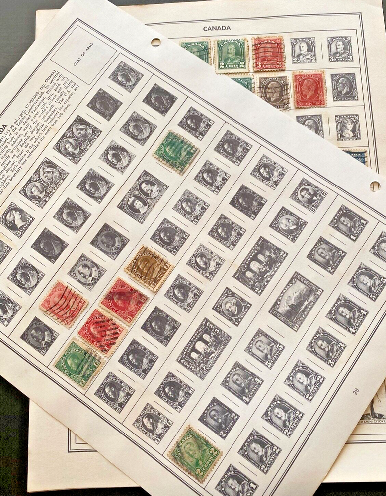 Worldwide Canada Stamps hinged on pages