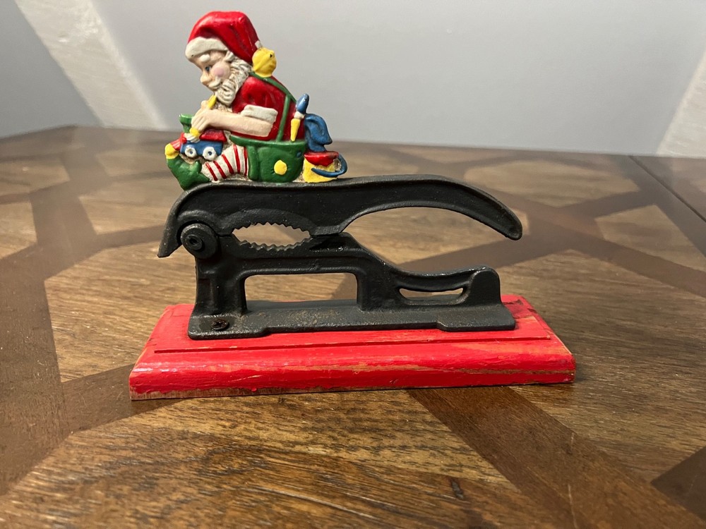 Old Fashioned Nutcracker Cast Iron on Wood Base santa theme nutcracker vintage