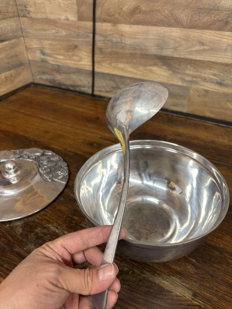 Handcrafted serving dish with lid embedded fruit and leaf designs, aluminum