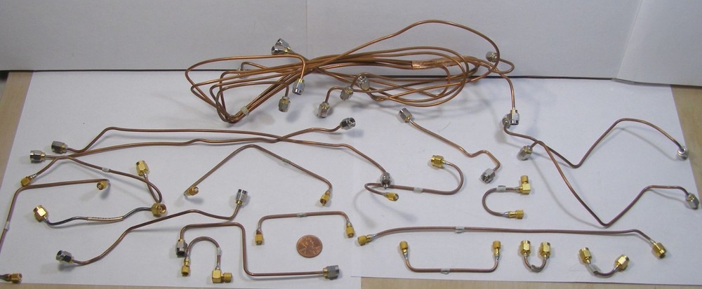 TWENTY-THREE ASSORTED BRASS SMA CABLES UNKNOWN BRAND