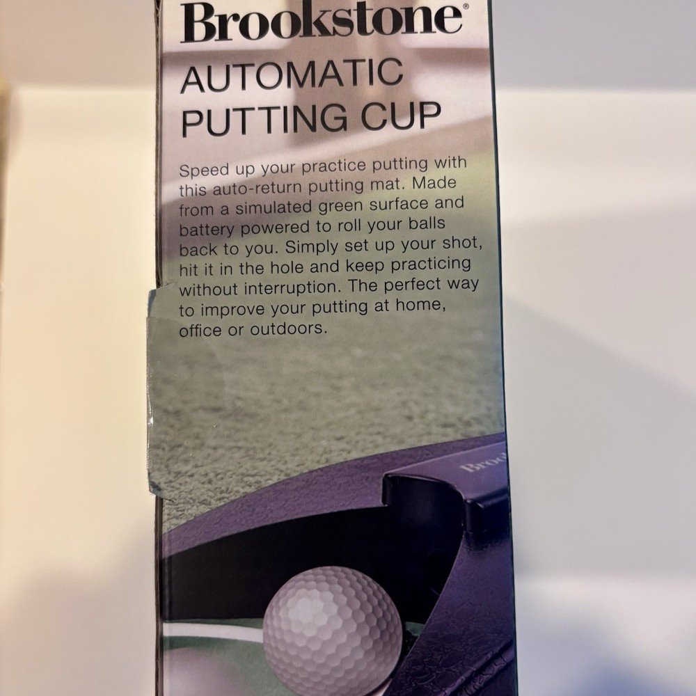 NIP / SEALED Brookstone Automatic Putting Cup Cordless Portable