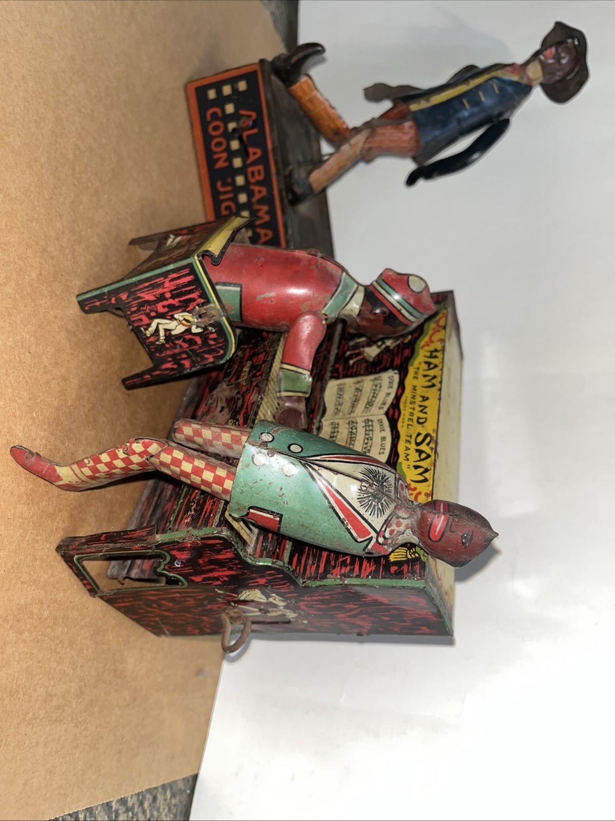 Set of 2 tin toys Ham and Sam The Minstrel Team & “TOMBO “Alabama Coon Jigger