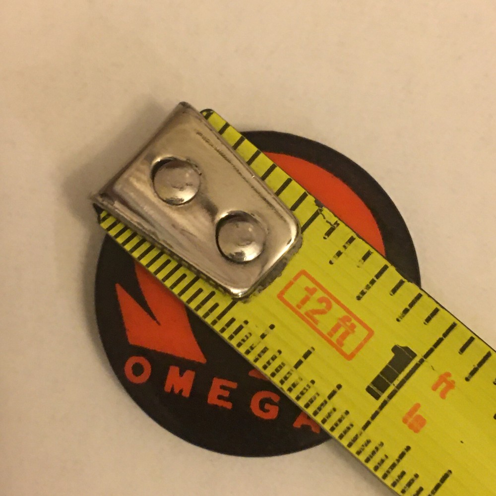 XIOM Omega pinback