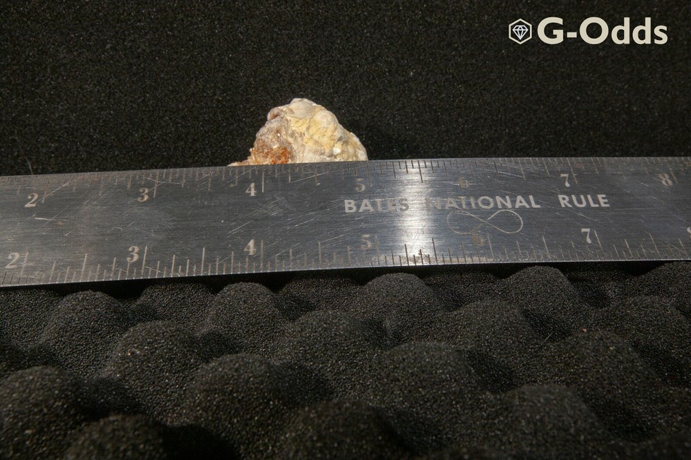 Rare broken geode around 2" with iron oxide and quartz