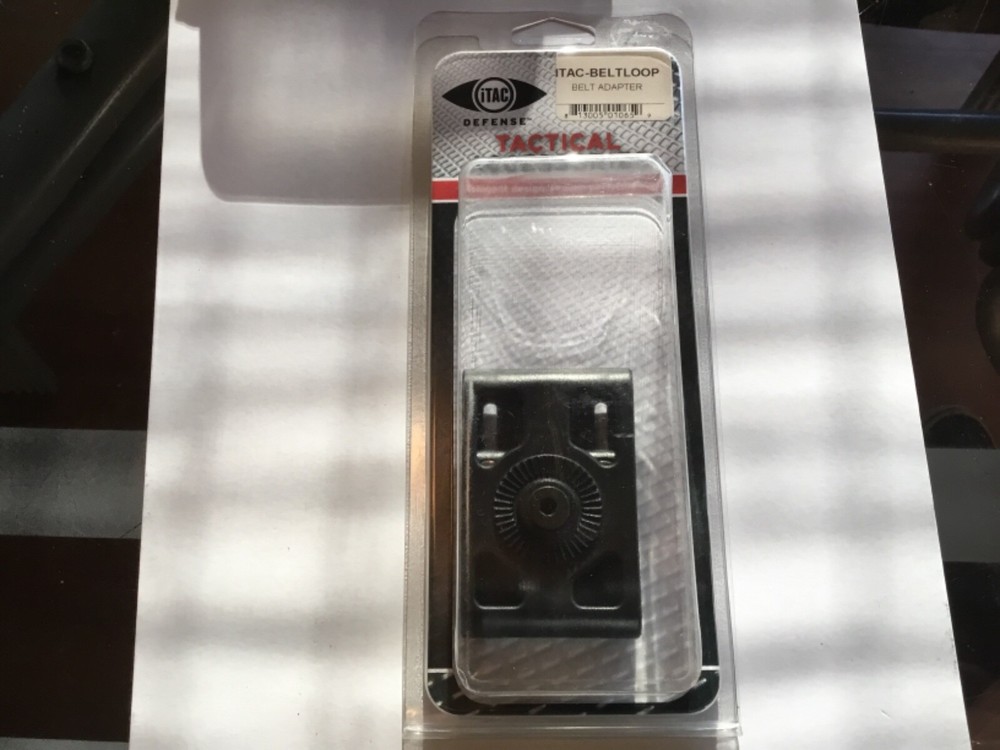 ITac paddle holster belt loop adapter.