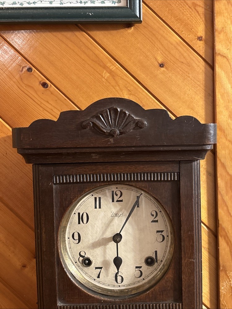 Vintage spring pendulum clock made by Meiji Clock Co.