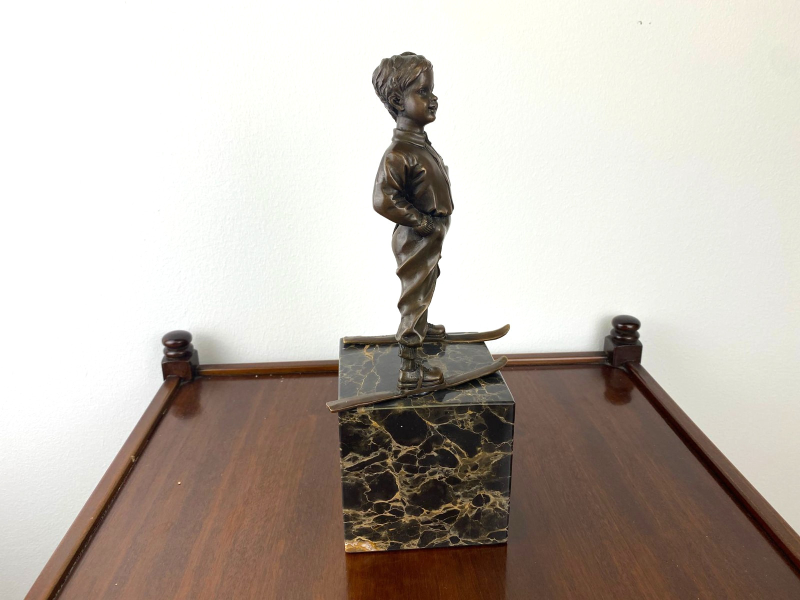 Bronze sculpture boy with ski on marble base after Ferdinand Preiss
