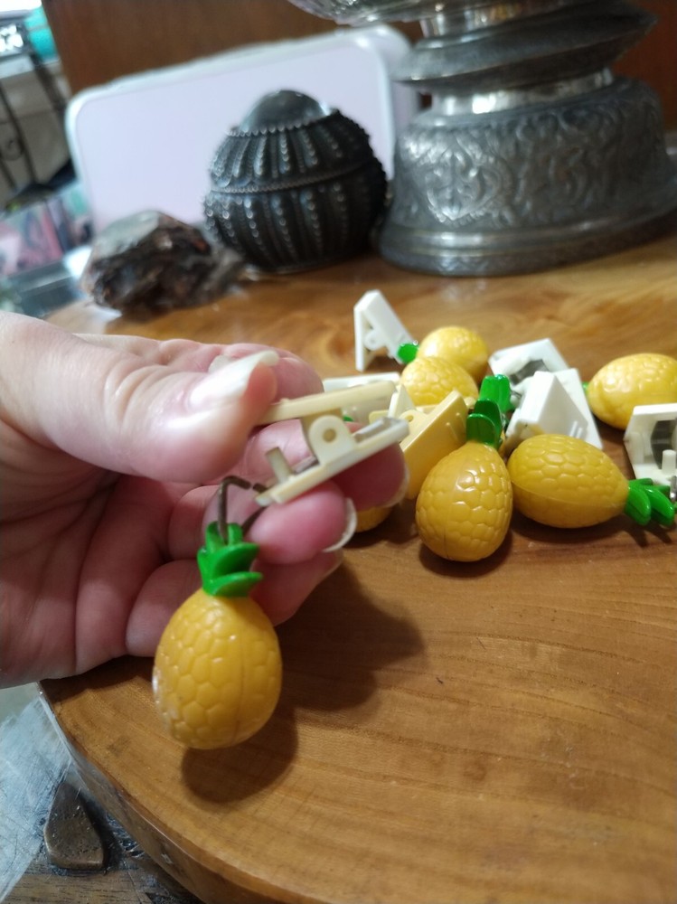 10 plastic pineapple shaped tablecloth weights. picnics, outdoor dining