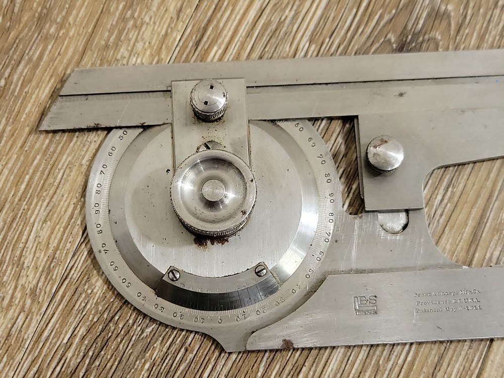 ABROWN & SHARPE UNIVERSAL BEVEL PROTRACTOR (Micrometer Protractor) May 9, 1911
