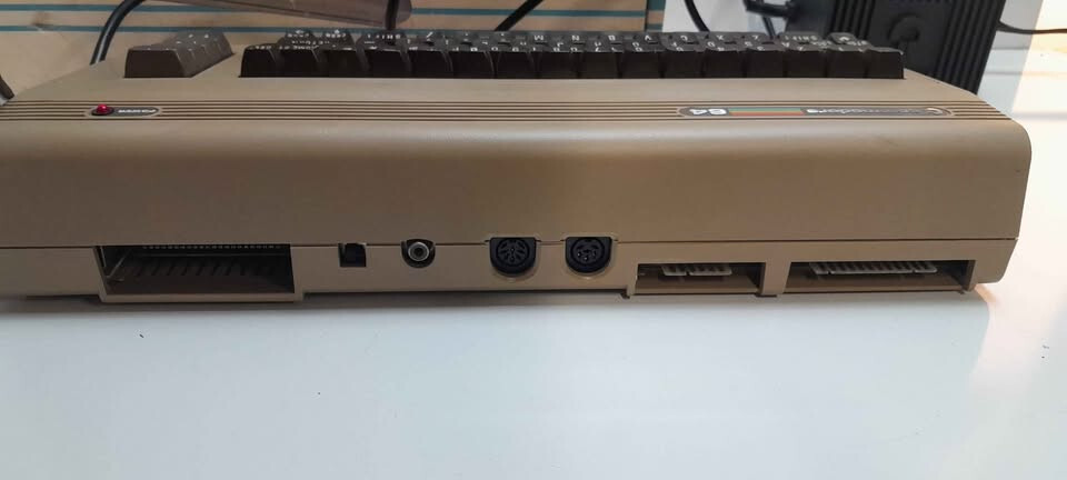 Vintage Commodore 64 computer in box, manuals and programs package