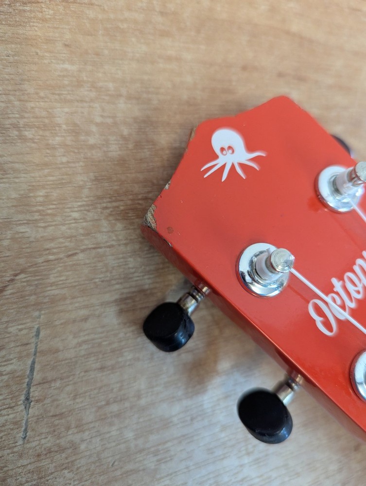 Octopus Soprano Ukulele Red with 4 Strings Includes Case for Beginners