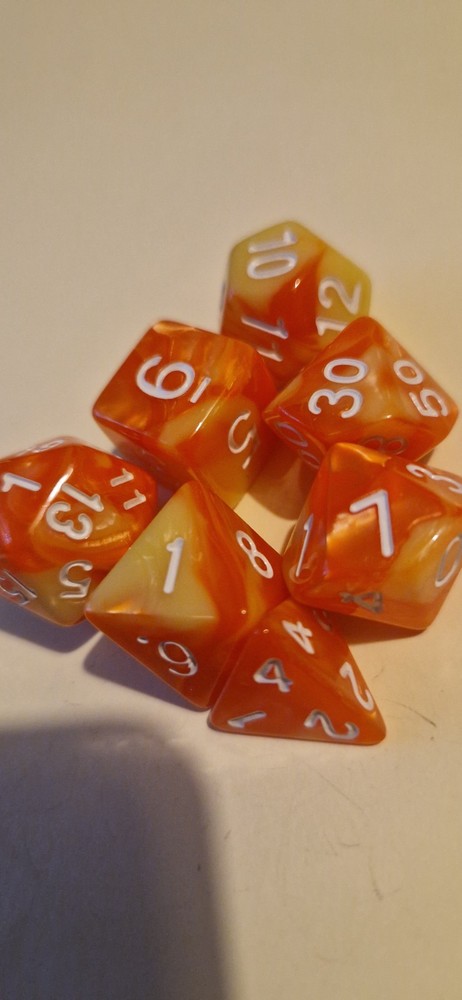 Orange and yellow marble effect D&D polyhedral dice set