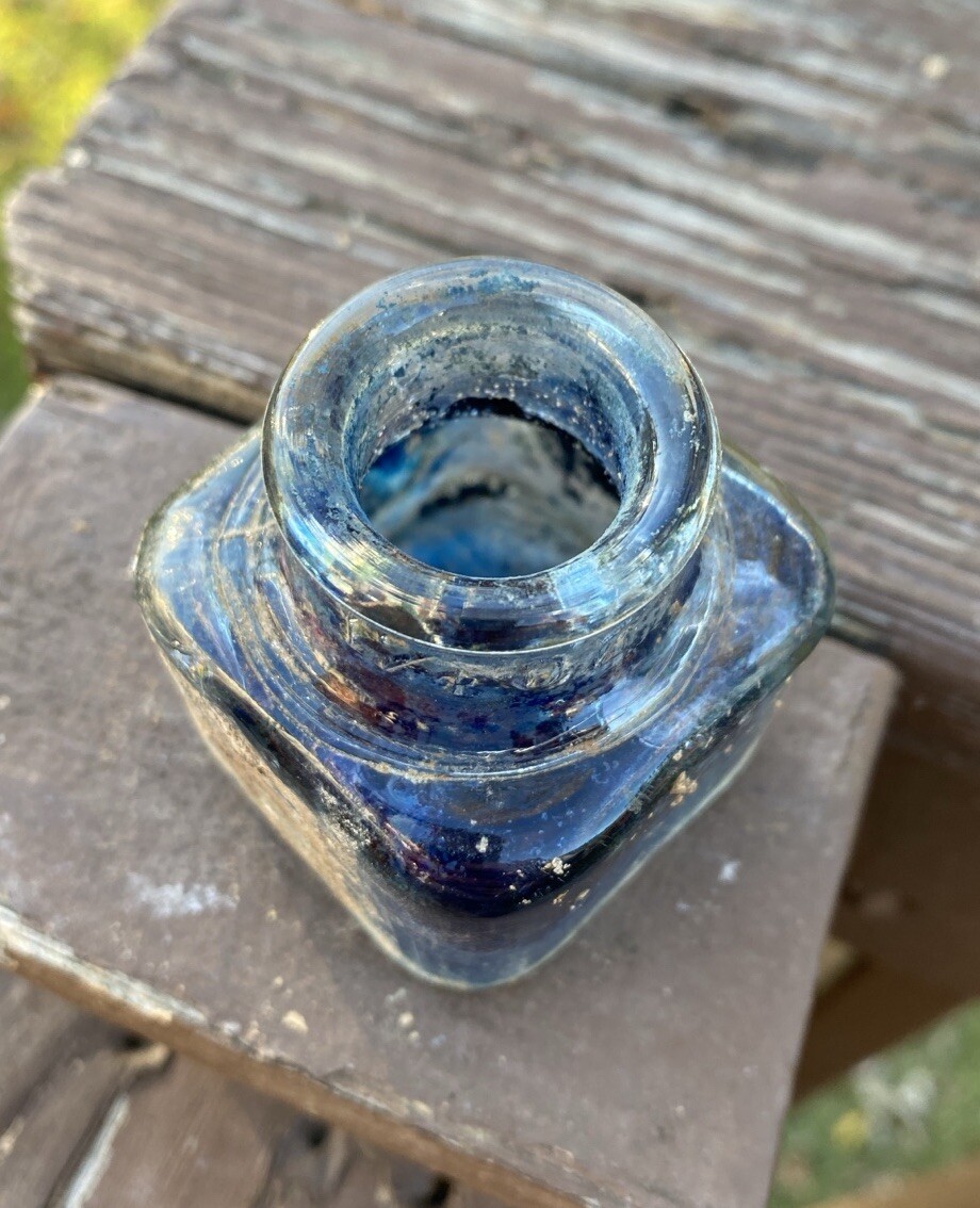 Clear Inkwell With Blue Ink And Partial Label