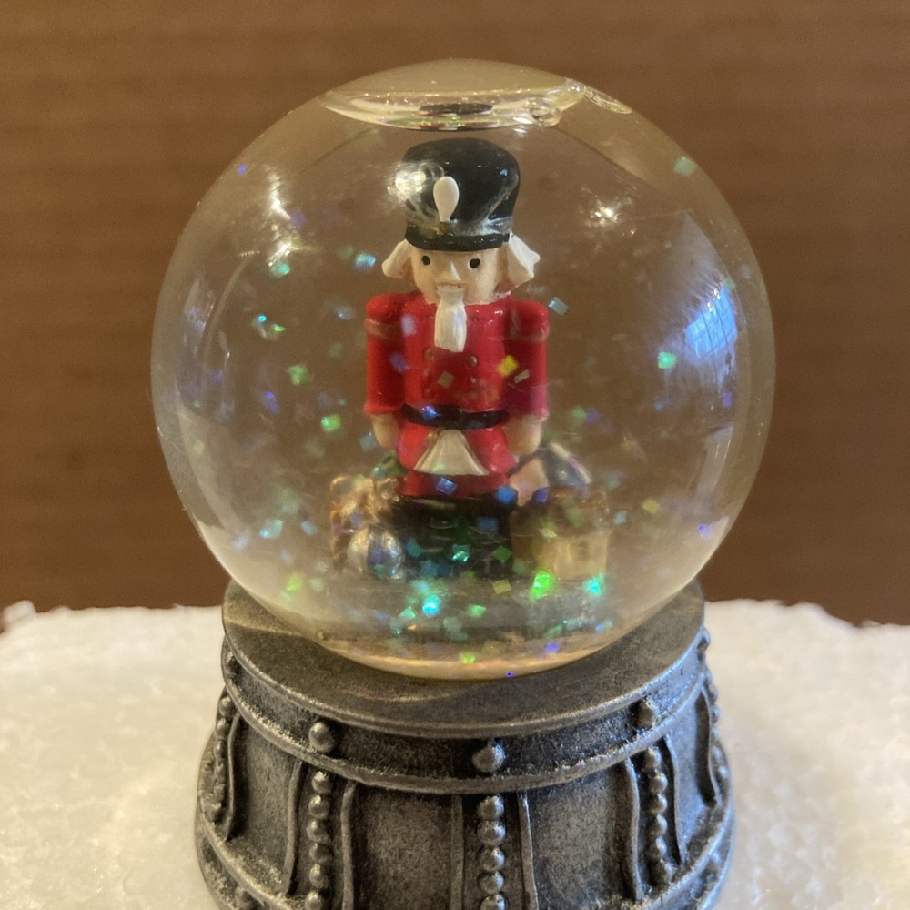 Mini Nutcracker Snow Globe With Metal Base Height 2.5 inches