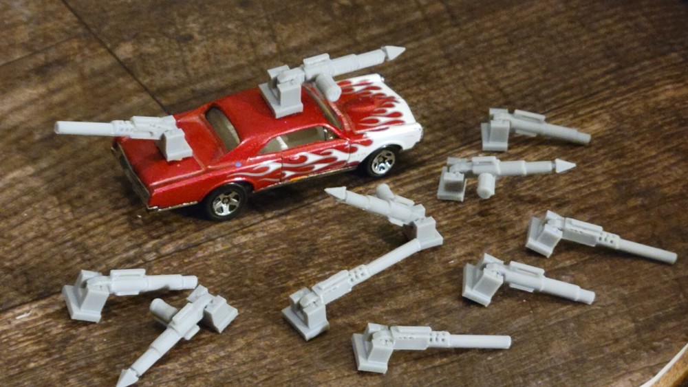 Adjustable, Moves Up or Down Weapons Pack Gray 3d printed. 1/64 scale. 11 items