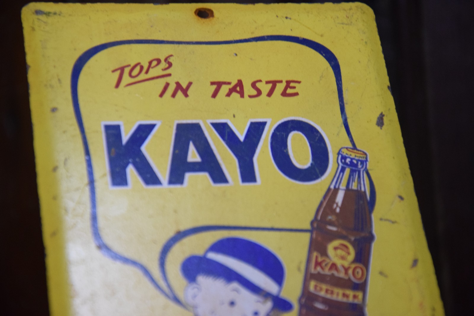 KAYO CHOCOLATE DRINK PAINTED METAL SIGN BOTTLE BOWLER MOON MULLINS CIRCA 1950s