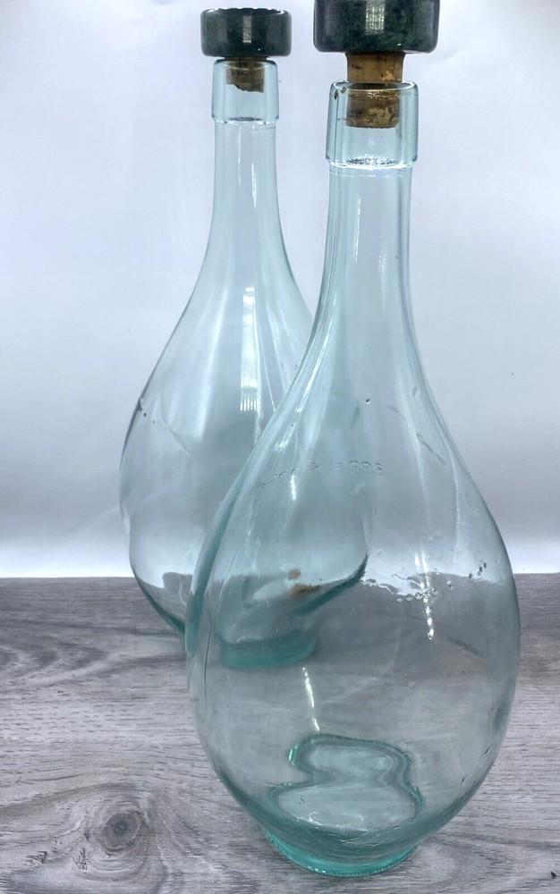 Two old wine bottles - 1 Cork inside - Label Residue