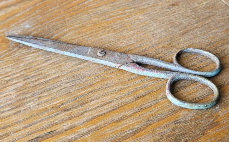 SCISSORS MADE IN GERMANY. RED PAINT HANDLE. NEEDS CLEANING. METAL