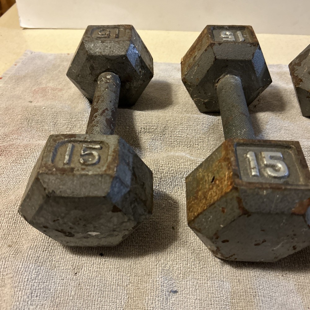 Three 15 Pound hex Head Cast Iron Dumbbells Silver