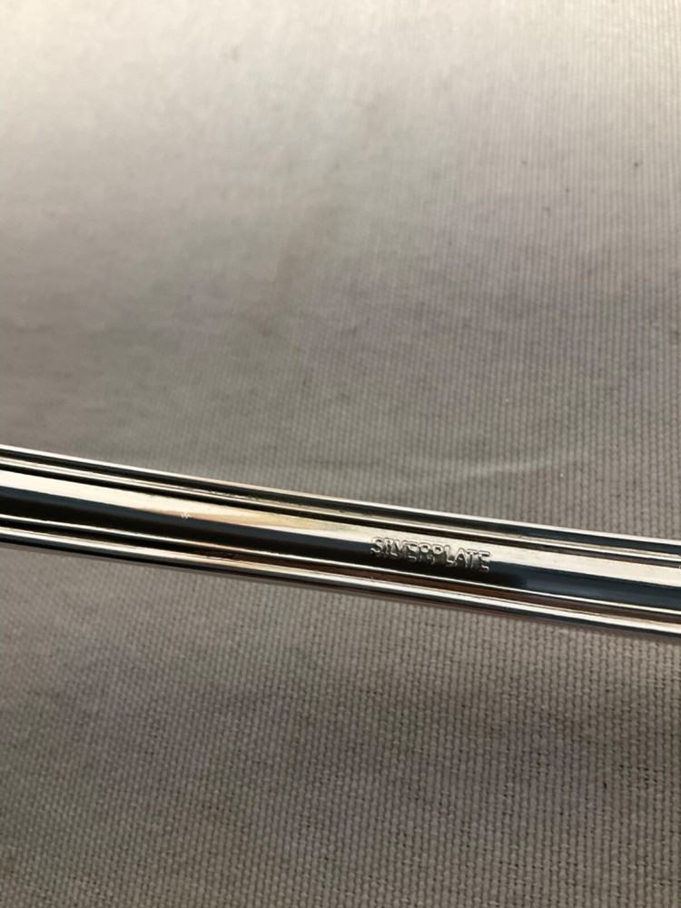 E B Rogers soup ladle silverplate attached rest 10”