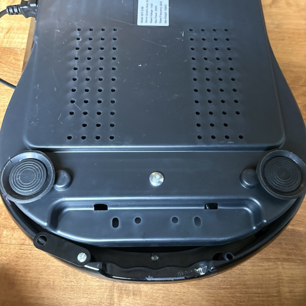 Black Vibration Plate Exercise Machine. Full-Body Vibrating Platform with Resist