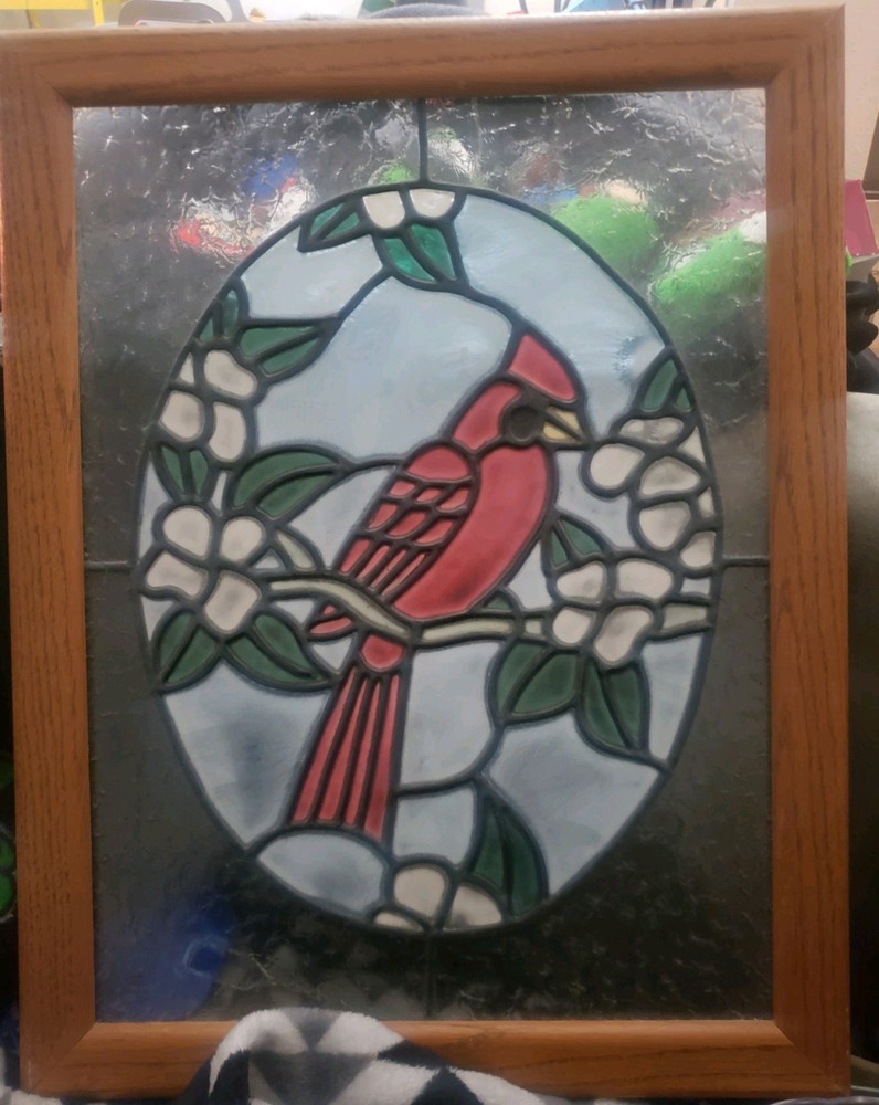 stained glass panel featuring a cardinal