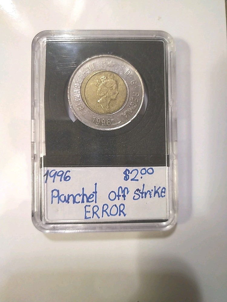 RARE MINTING ERROR 1996 CANADA $2 COIN. OFF CENTRE PLANCHET STRIKE ERROR.