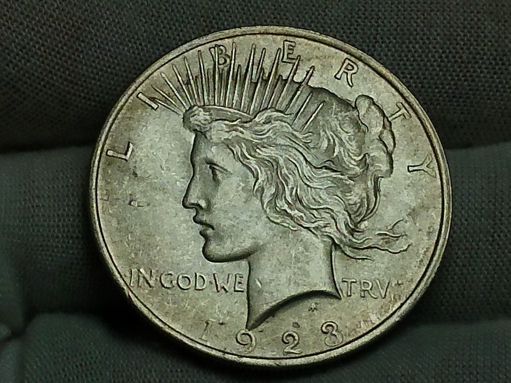 Raw 1923 Peace Silver Dollar - Philadelphia - Small Lamination Error