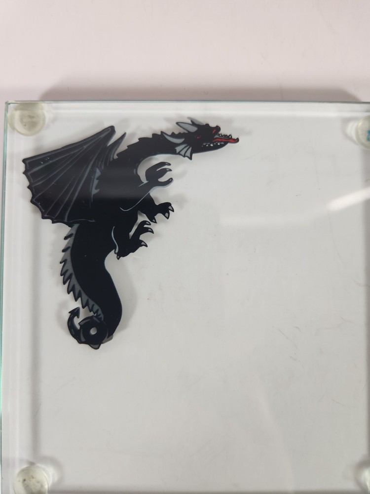 Glass Coasters With Dragon Silhouettes