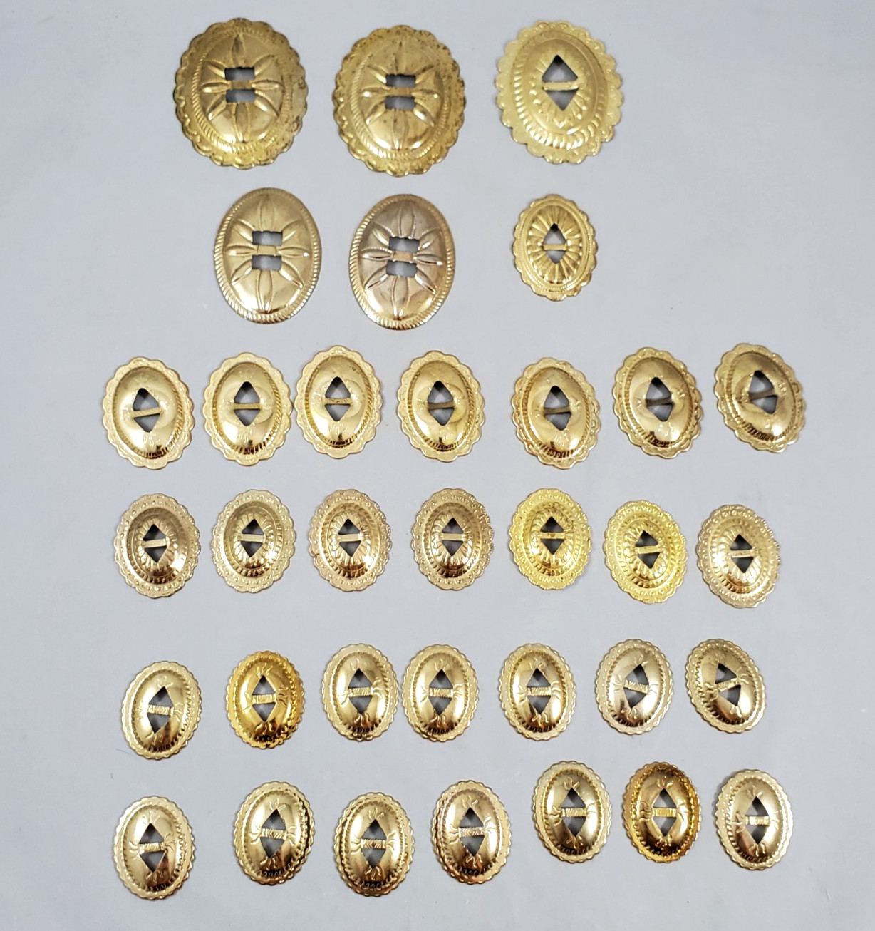 Lot of 34 Slotted Oval Conchos Brass Tone Scalloped Different Sizes Crafts Vtg