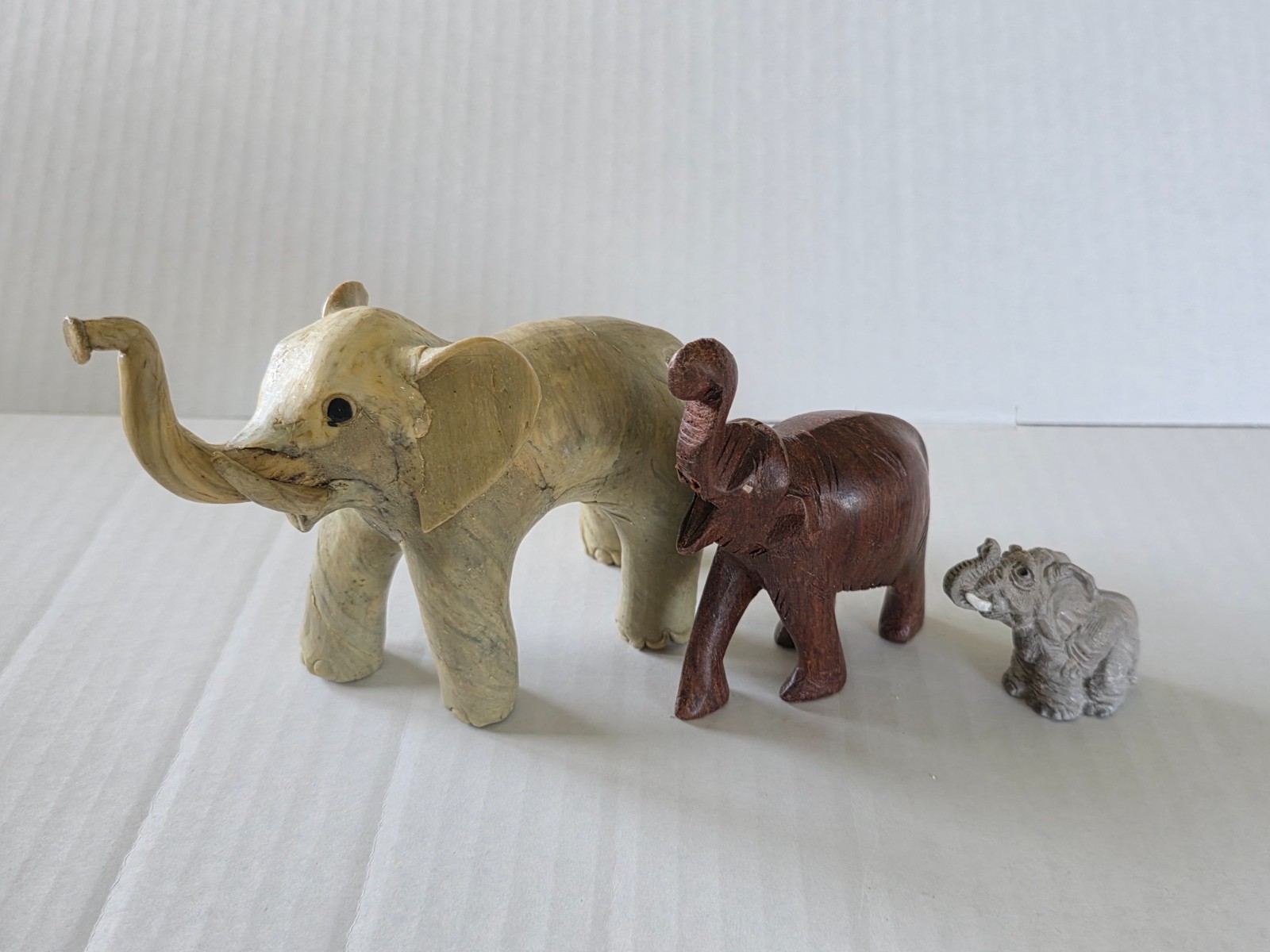 Three elephant figurines