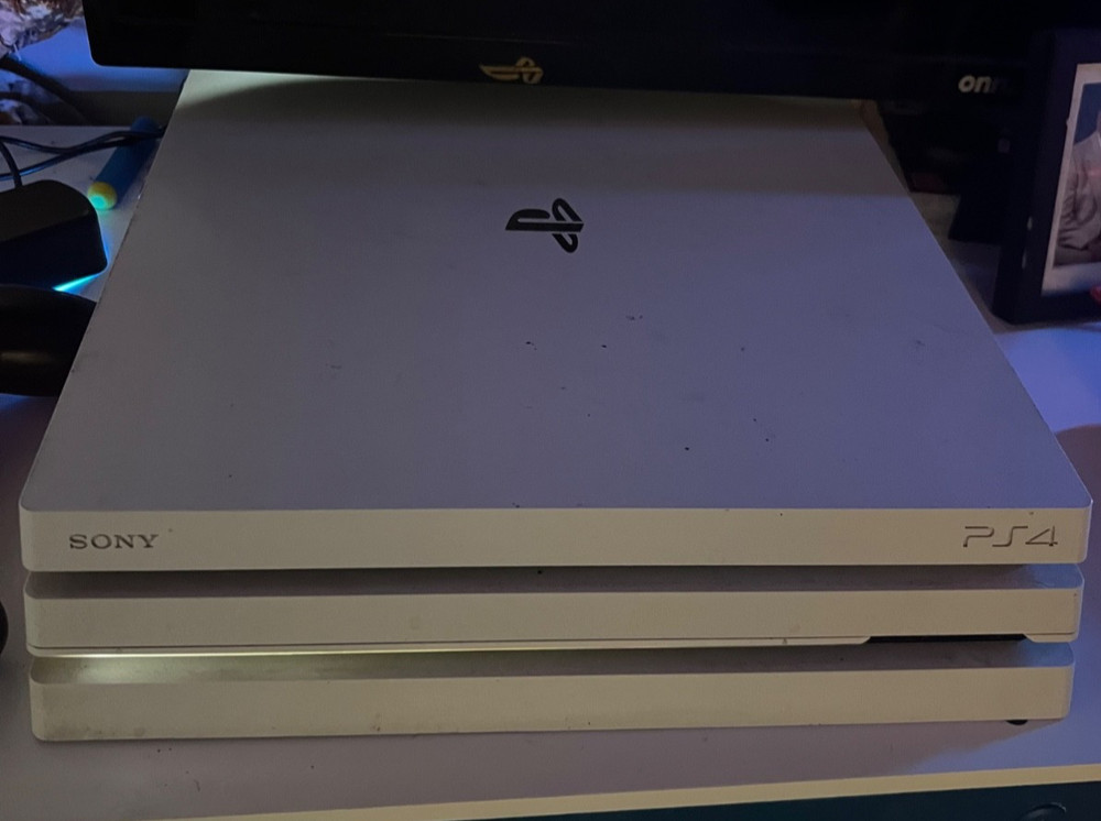 ps4 console pro with controller and games