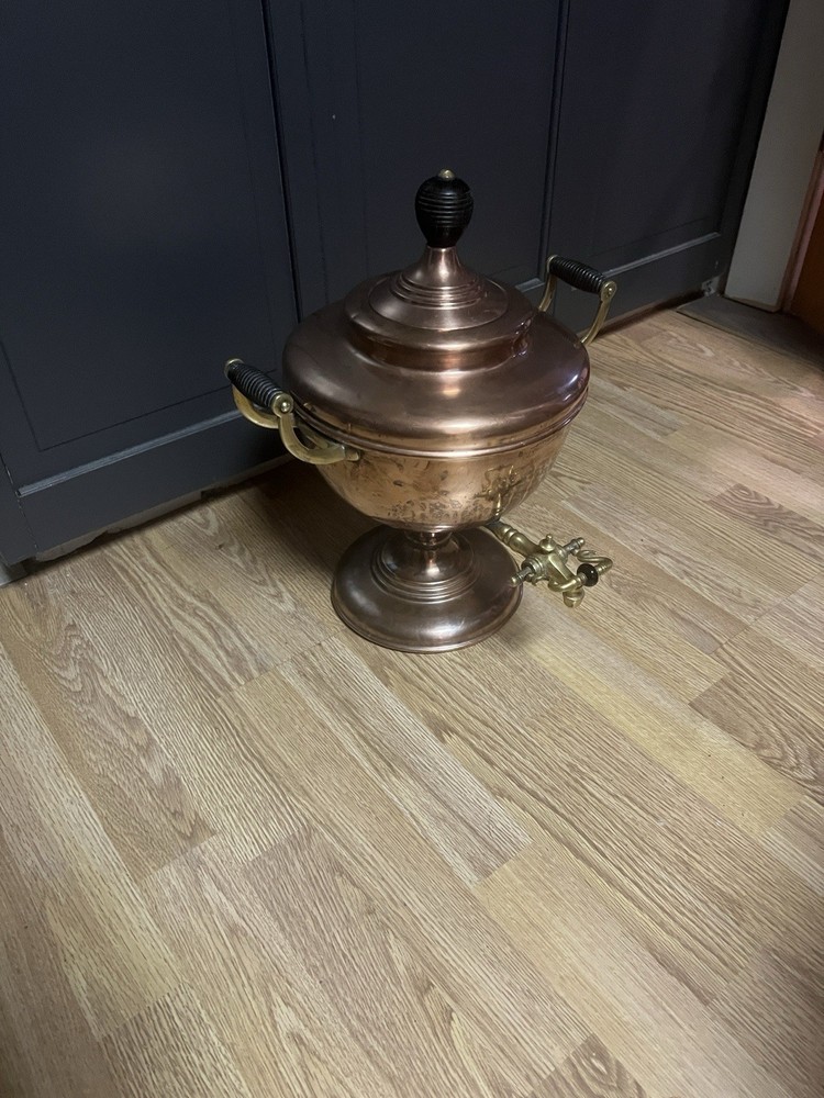 This is an antique Victorian copper and brass tea urn, samovar