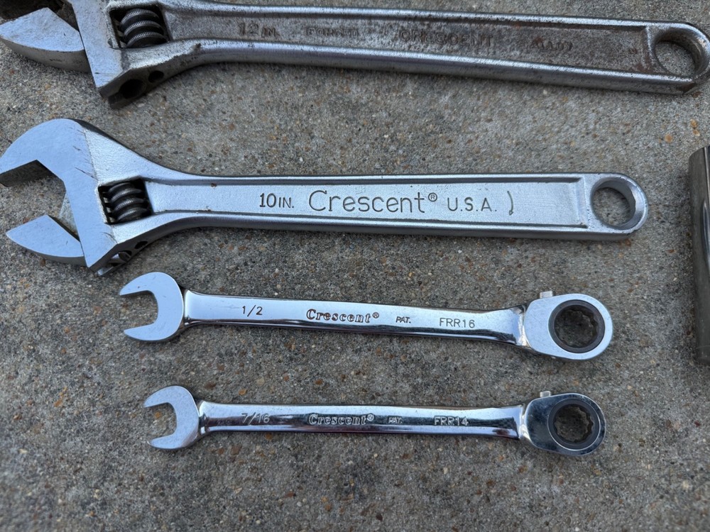 Crescent Tool adjustable wrench, locking plier, two ratcheting wrenches, socket