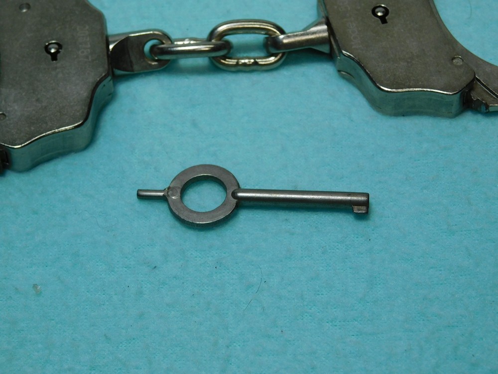 Peerless Handcuff Co. Model 500 Nickle Plated Handcuffs With Key.