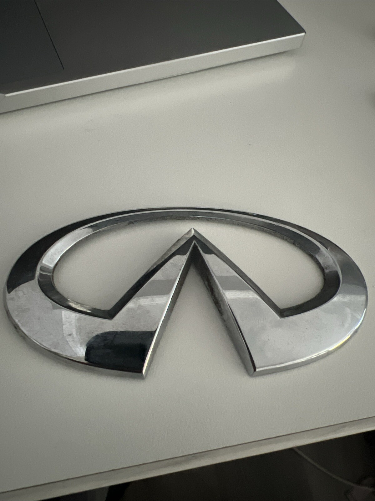 infiniti engine cover emblem